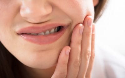 What Causes Tooth Sensitivity and How Can You Treat It?